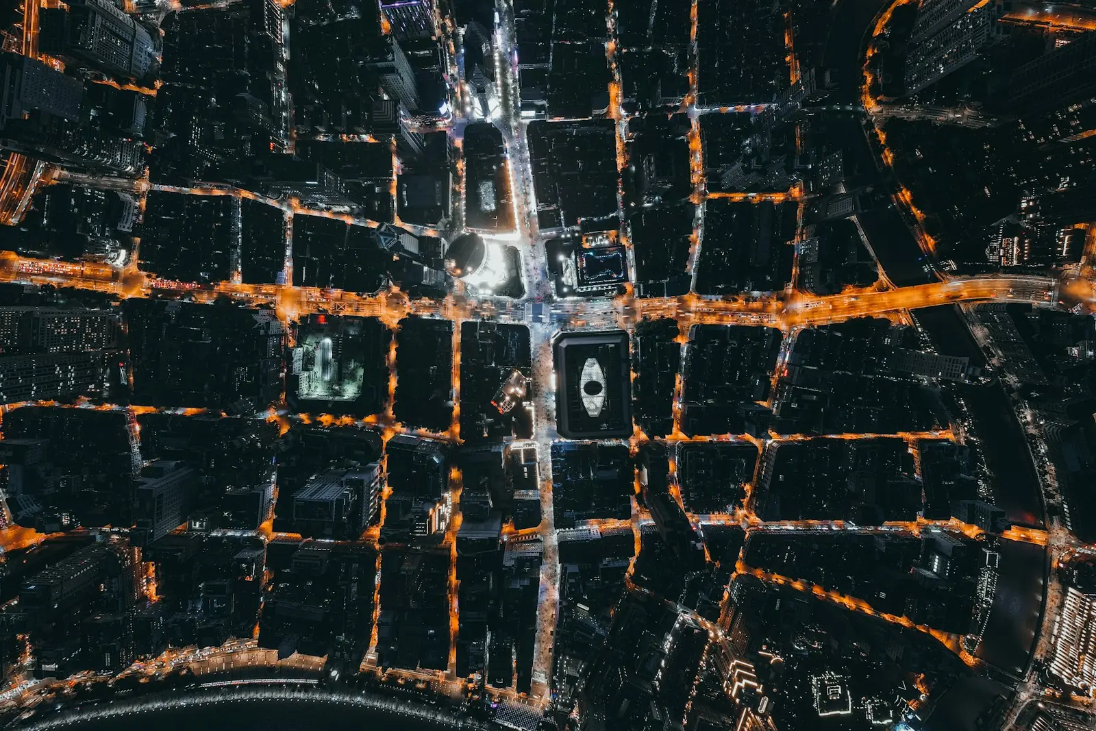 A city's street grid at night, seen from directly above
